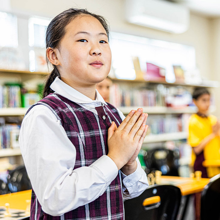 Student praying at Christ the King Catholic Primary School North Rocks
