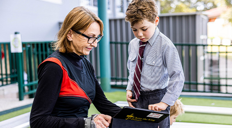 teacher and student on iPad at Christ the King Catholic Primary School North Rocks