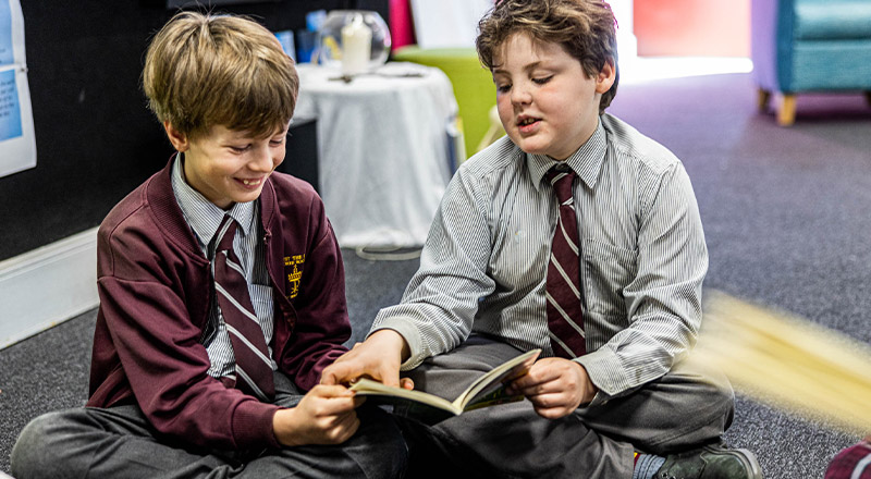 students reading and laughing at Christ the King Catholic Primary School North Rocks