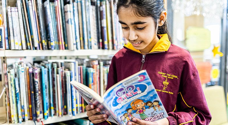 Student reading in library at Christ the King Catholic Primary School North Rocks