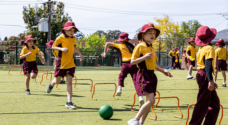 Students running on lawn at Christ the King Catholic Primary School North Rocks