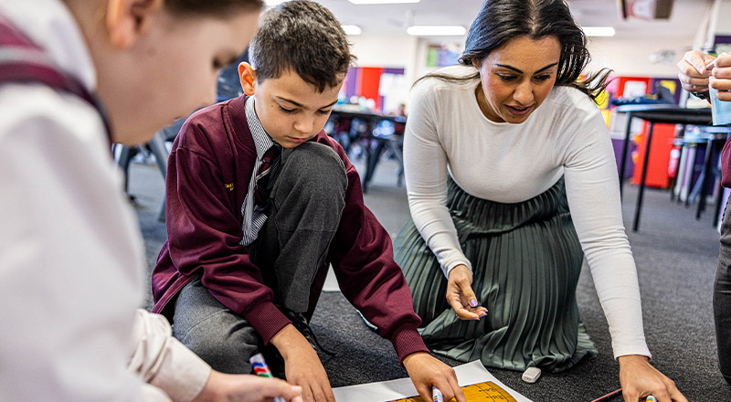 Teacher assisting student at Christ the King Catholic Primary School North Rocks