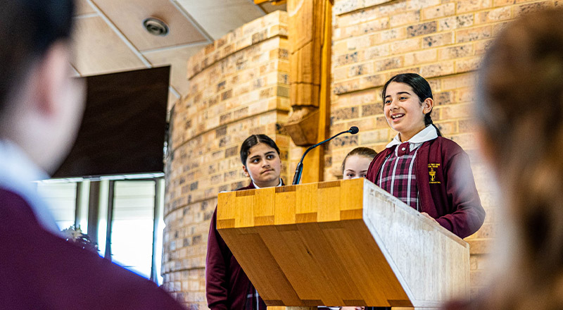 Student at lectern at Christ the King Catholic Primary School North Rocks