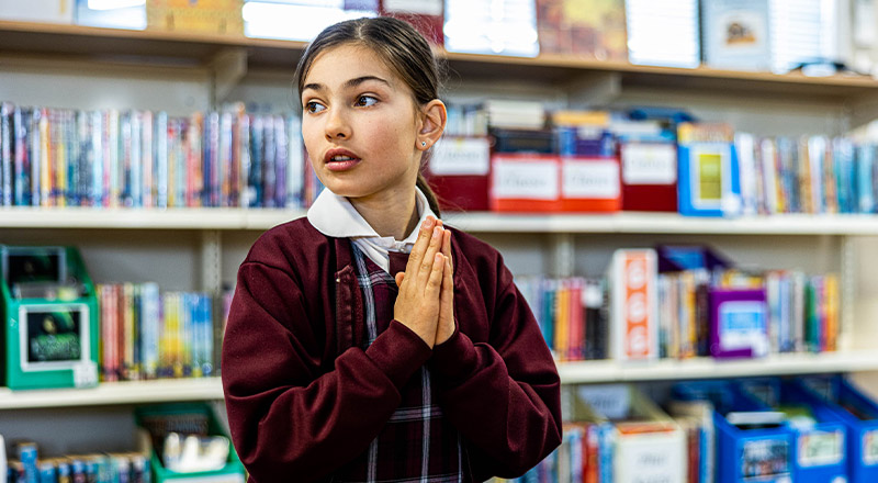 Student praying at Christ the King Catholic Primary School North Rocks