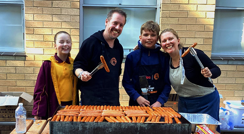 Parents and students at sausage sizzle at Christ the King Catholic Primary School North Rocks