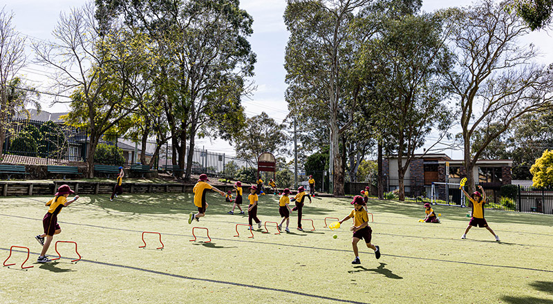 Students running on lawn at Christ the King Catholic Primary School North Rocks