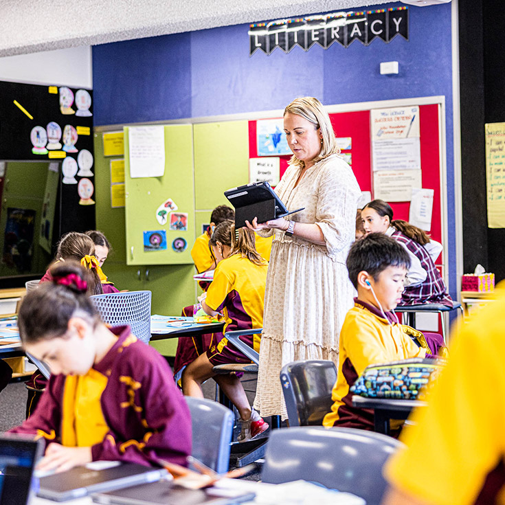 Teacher with class at Christ the King Catholic Primary Nth Rocks